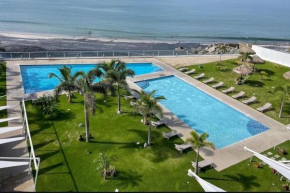 Beachfront Apt with optional cook and airport pickup